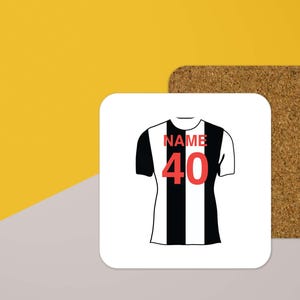 May include: A white coaster with a black and white football jersey design. The jersey has the word "NAME" and the number "40" printed on it.