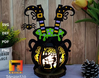 May include: A black cauldron with green liquid and two witch legs sticking out of the top. The cauldron is lit from inside with a warm yellow light. The cauldron is on a wooden base. The image includes the text "Tdesign510" and the number "3022".