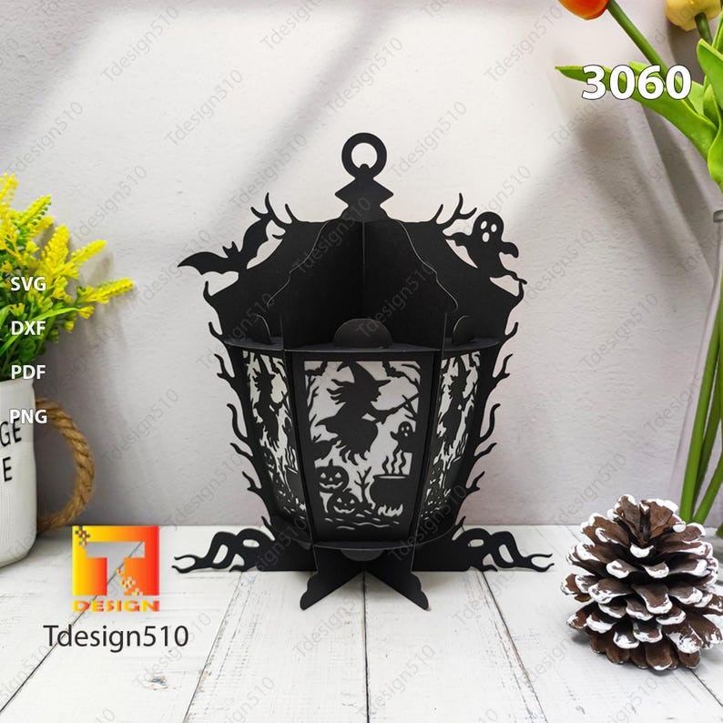 May include: Black Halloween lantern with a witch, bats, and ghosts cut-out design. The lantern has a handle and a base. The text "Tdesign510" is visible. The number "3060" is also visible.