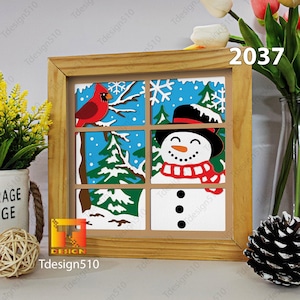 May include: A wooden framed picture with a winter scene. The picture is divided into nine squares, each with a different winter scene. The top left square shows a red cardinal perched on a branch. The top middle square shows a snowy landscape with snowflakes. The top right square shows a pine tree. The middle left square shows a snowy landscape with a pine tree. The middle middle square shows a snowman with a red and white scarf. The middle right square shows a snowy landscape with a pine tree. The bottom left square shows a snowy landscape with a pine tree. The bottom middle square shows a snowy landscape with a pine tree. The bottom right square shows a snowy landscape with a pine tree.