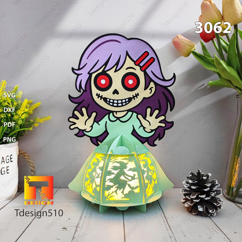 May include: A Halloween paper lantern depicting a cartoon girl with purple hair, red eyes, and a skeletal grin. The lantern's base is light green, with a witch silhouette design. The number "3062" is visible.