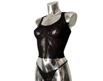 May include: A black tank top and matching underwear on a mannequin.