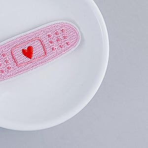 Opstrijkpatch | Roze verband