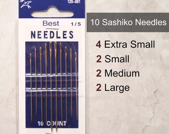 Könnte beinhalten: Eine Packung mit 10 Sashiko-Nadeln der Marke Double Swallow, Modell 120-081. Das Set enthält 4 extra kleine, 2 kleine, 2 mittlere und 2 große Nadeln. Die blau-weiße Verpackung trägt die Aufschrift Best, NEEDLES und 10 COUNT.