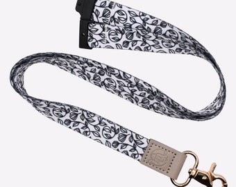 Lanyard Botanical Breakaway / Lanyard in tessuto con motivo vegetale bianco e chiusura dorata