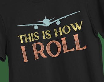 May include: Black t-shirt with a vintage-style airplane graphic and the text "This is how I roll".