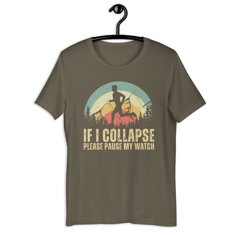 May include: A brown t-shirt with a vintage-style graphic of a runner in front of a mountain range. The text "IF I COLLAPSE PLEASE PAUSE MY WATCH" is printed below the graphic.