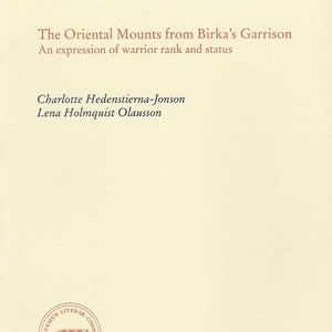 May include: A cream-colored book cover with the title "The Oriental Mounts from Birka's Garrison" and the subtitle "An expression of warrior rank and status". The authors are listed as Charlotte Hedenstierna-Jonson and Lena Holmquist Olausson. The cover also includes a red seal with the text "Certamen Literar-Constit" and the year "MDCCLIII". Below the seal is the text "Antikvariskt arkiv 81". At the bottom of the cover is the text "Kungl. Vitterhets Historie och Antikvitets Akademien."