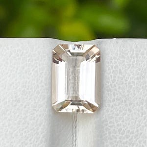 Rare Natural Imperial Topaz, 3.40 carats / loop Clean / peach / emerald cut .