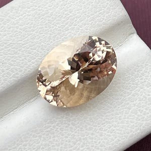 Rare Natural Imperial Topaz, 8.05 carats /  loop Clean / peach / oval shape.