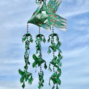 Thai green fish mobile weaved with palm leaves painted bright silver. It’s a handmade weave work as a decoration.
