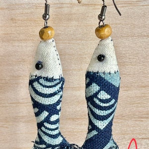 Small fish earrings made of cotton. It’s handmade earrings.