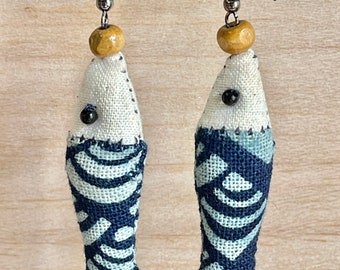 Small fish earrings made of cotton. It’s handmade earrings.