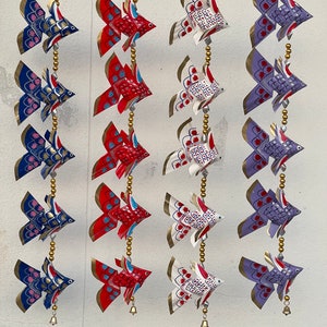 Tiny fish strung into cute lines It is handmade for decoration.
