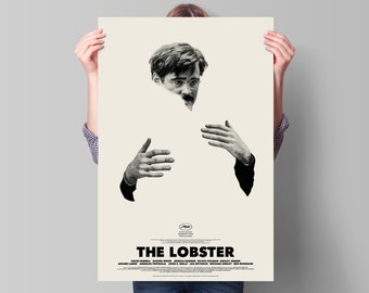 May include: A black and white poster for the movie "The Lobster" featuring a man's face and hands. The poster is 24 inches by 36 inches.