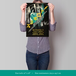May include: A vintage style poster for the film Metropolis, featuring a woman's face with Japanese text and the title "METROPOLIS" in yellow lettering. The poster is 12 inches by 18 inches.