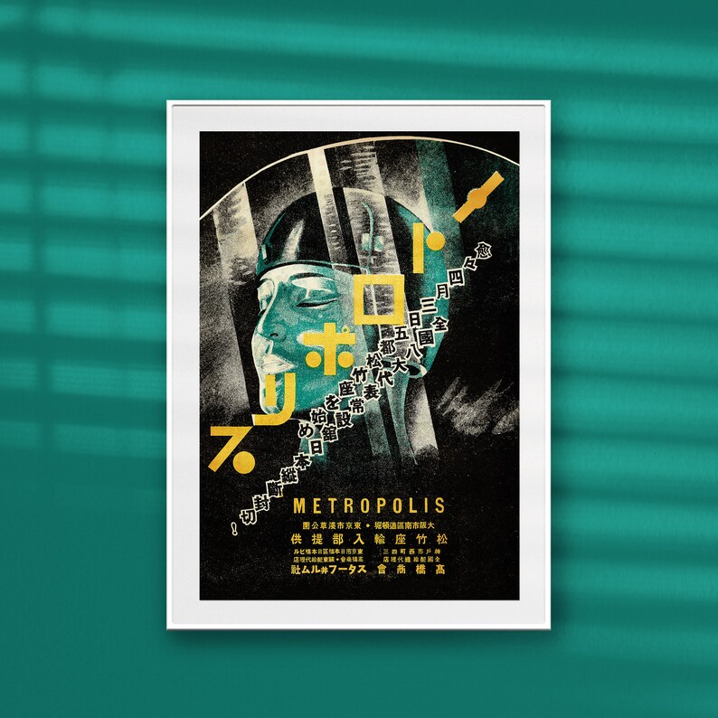 May include: A vintage Japanese movie poster for the film "Metropolis" featuring a stylized image of a woman's face with the title in gold lettering.