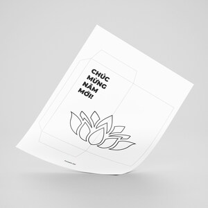 May include: Printable black and white paper craft of a lotus flower with the text "Ch&uacute;c Mừng Năm Mới!" which translates to "Happy New Year!" in Vietnamese.