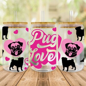 May include: Three clear plastic tumblers with bamboo lids and straws. Each tumbler has a pink heart with a black pug silhouette inside. One tumbler has the text "Pug Love" in pink letters.