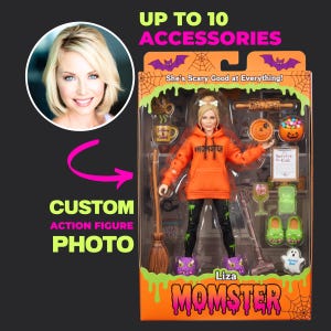 May include: A custom action figure in a box labeled "Liza MOMSTER" and "She's Scary Good at Everything!" The figure wears an orange hoodie with "#MOMSTER" and black leggings with green slime patterns. Accessories include a broom, mug, rolling pin, pie, clipboard, wine glass, green slippers, and a ghost figure.