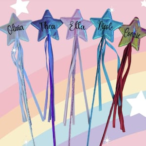 May include: Five iridescent star-shaped wands with colourful ribbons. Each wand has a name written on it: Olivia, Thea, Ella, Nicole, and Connie.