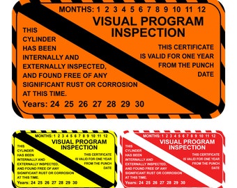 May include: A visual program inspection certificate with black and yellow stripes. The certificate is orange with black text and states that this cylinder has been internally and externally inspected and found free of any significant rust or corrosion. The certificate is valid for one year from the punch date. The months of the year are listed from 1 to 12. The years are listed from 24 to 30.
