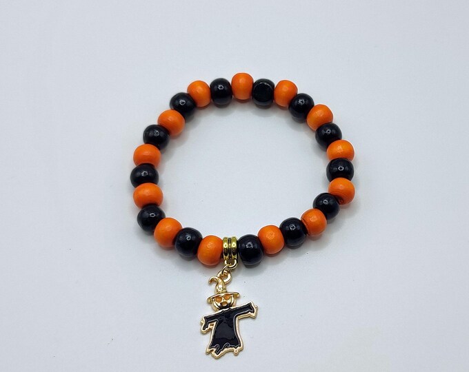 Orange And Black Wooden Beaded Bracelet With Scarecrow Charm.