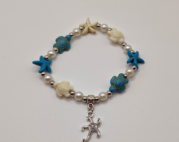 Turquoise, White and Blue Ocean Themed Bracelet with Tibetan Silver Spacers, Starfish Beads and a Starfish Charm.