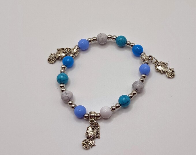 Turquoise, White and Blue Ocean Themed Bracelet with Tibetan Silver Spacers and Fish Charms.