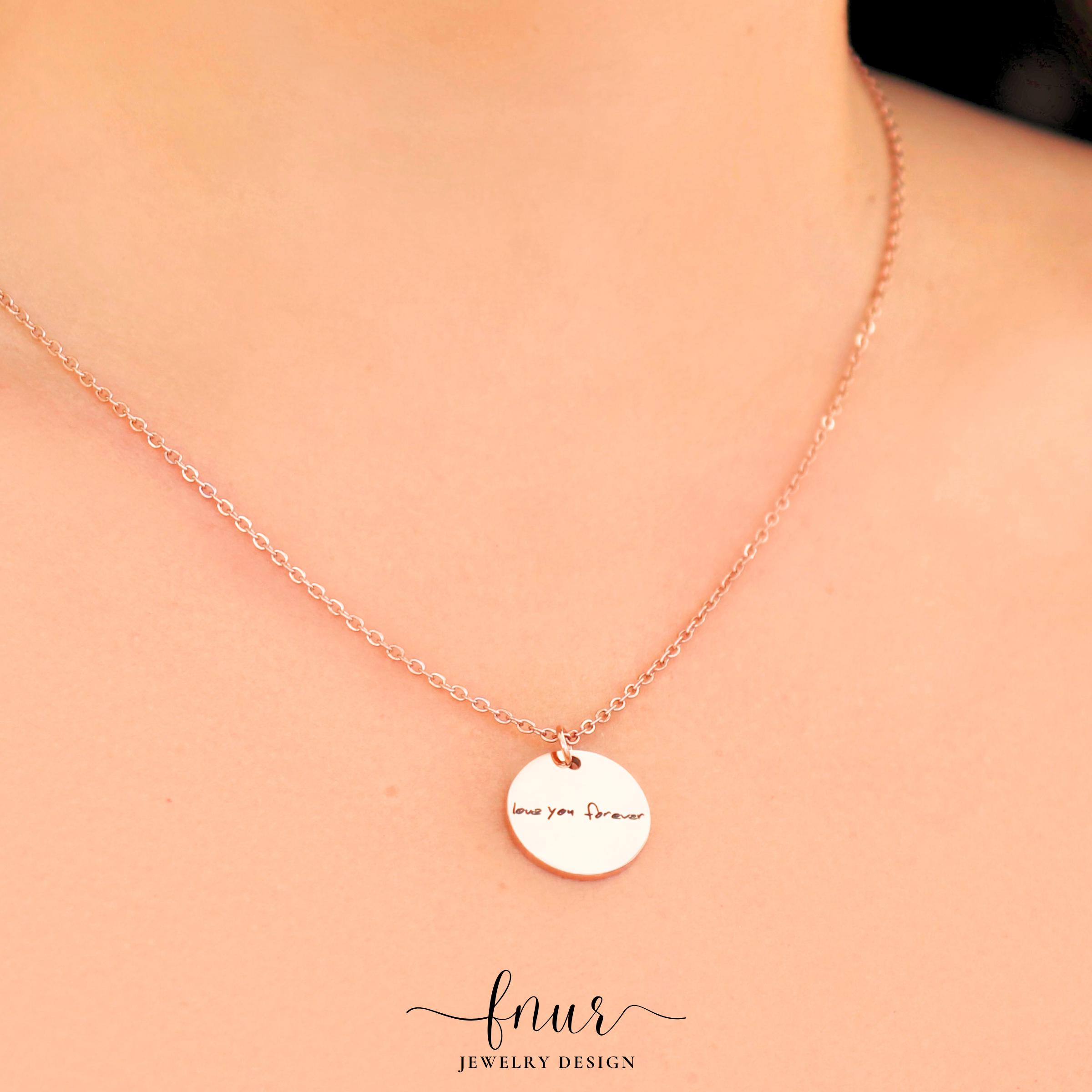 three different sizes of personalized handwriting disc necklaces arranged from smallest to largest