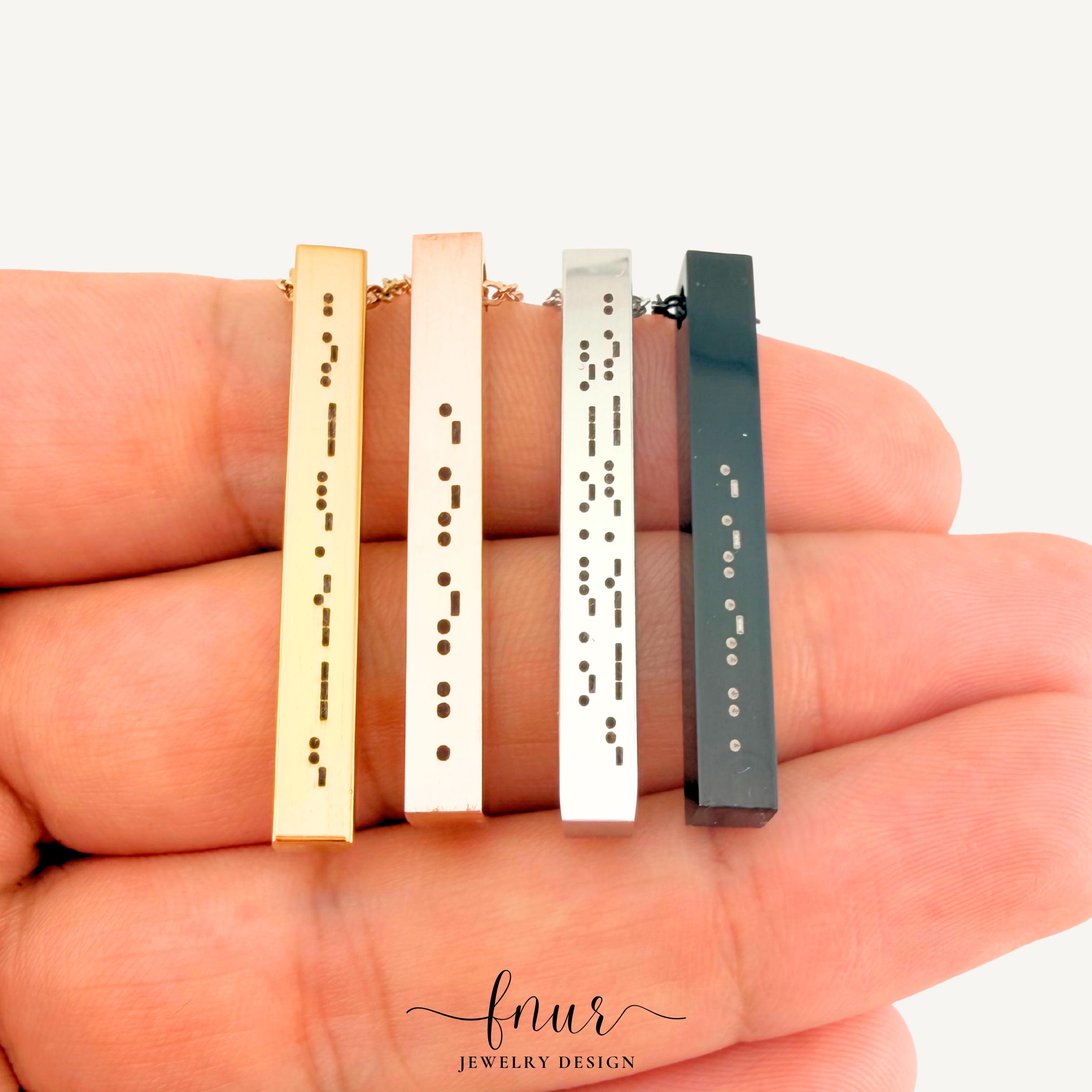 model wearing gold personalized morse code bar necklace on neck