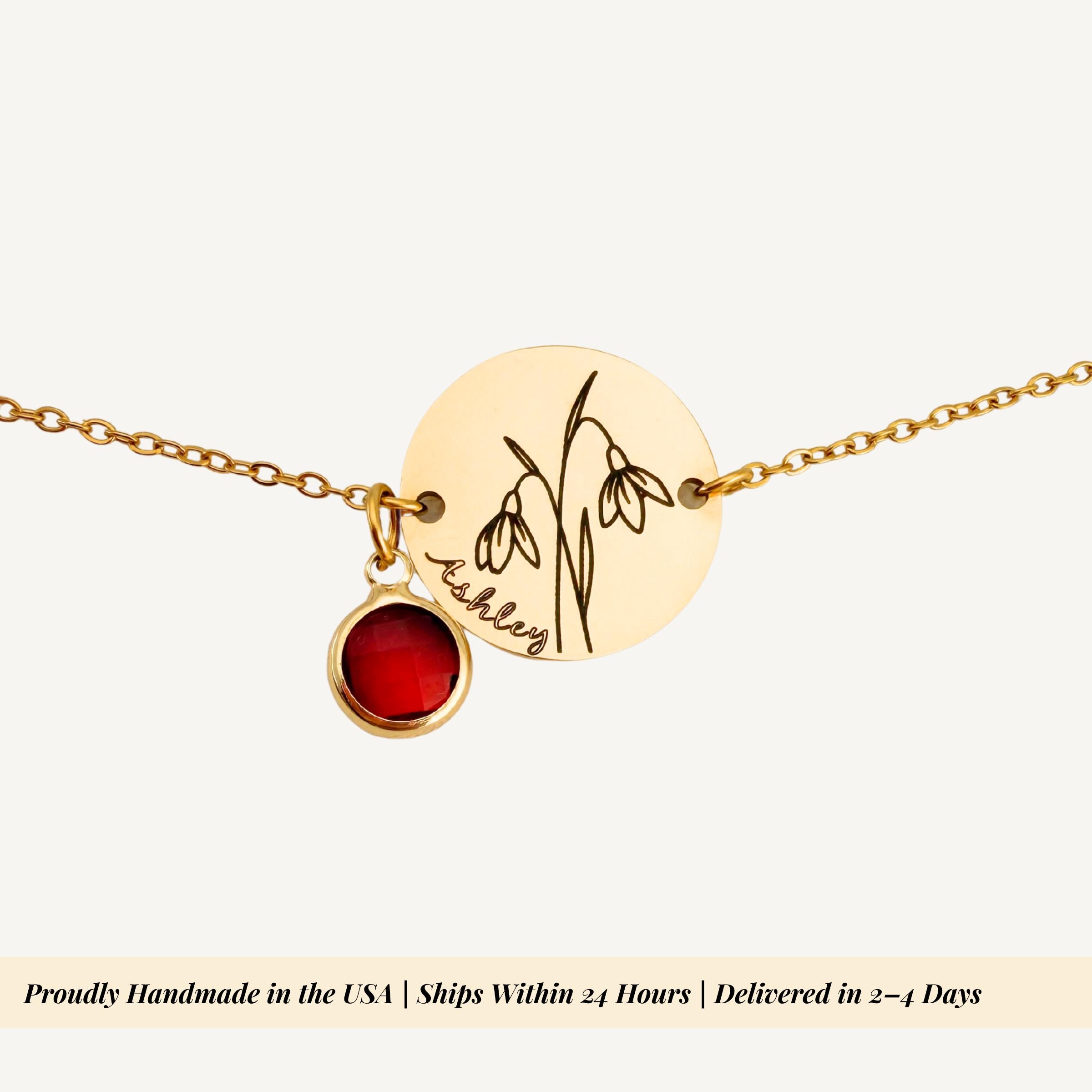 Close up view of engraved floral charm showing intricate birth flower detailing and texture