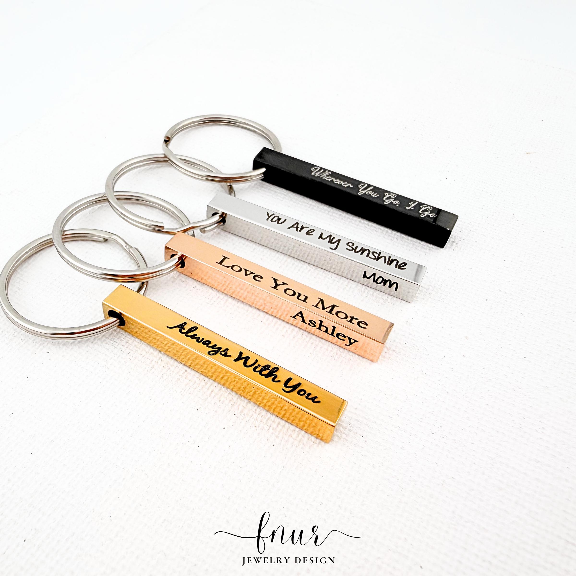 detail shot of sturdy keyring connector attached to sleek personalized metal bar