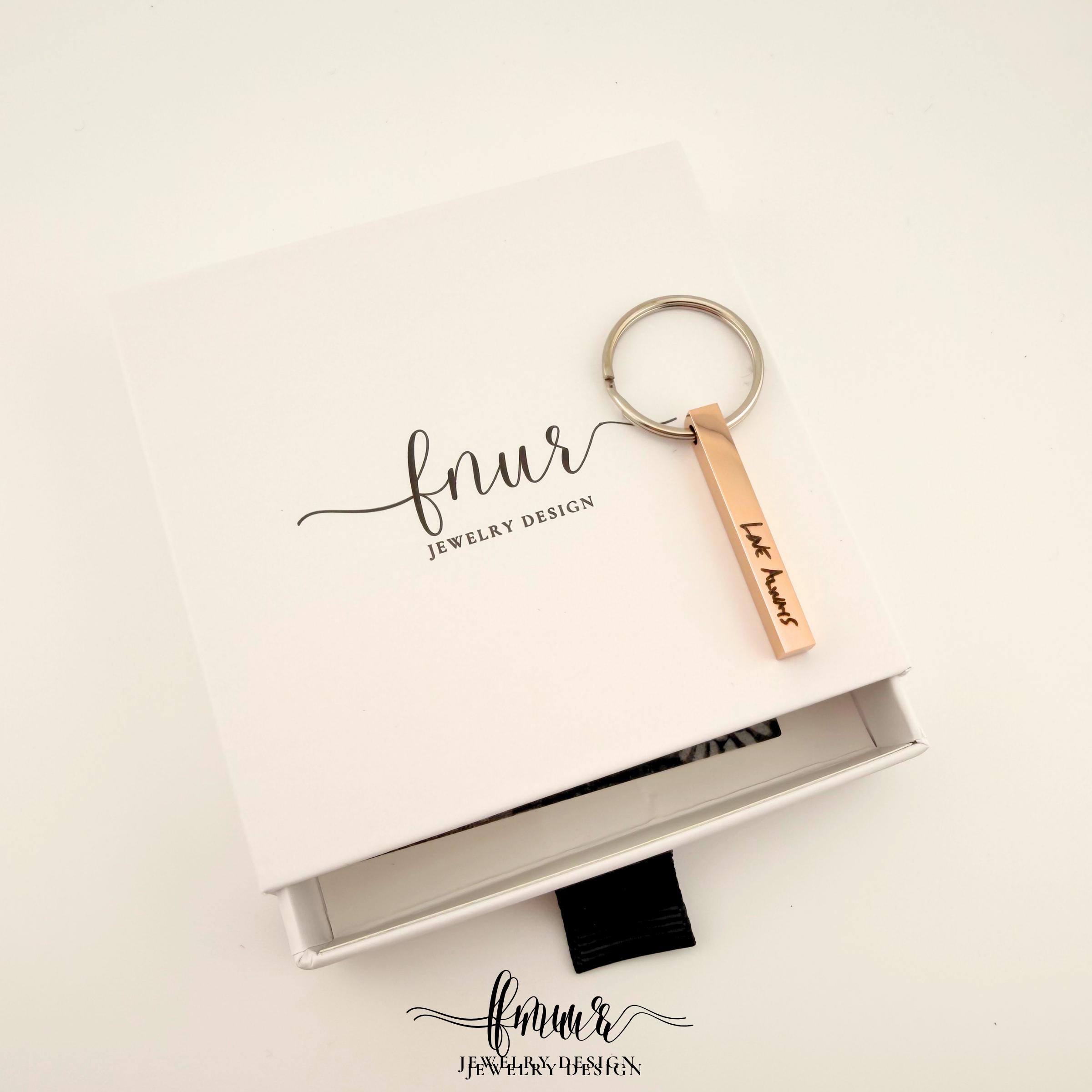 Handwriting keychain captured from side profile showing durability and thickness of stainless steel bar
