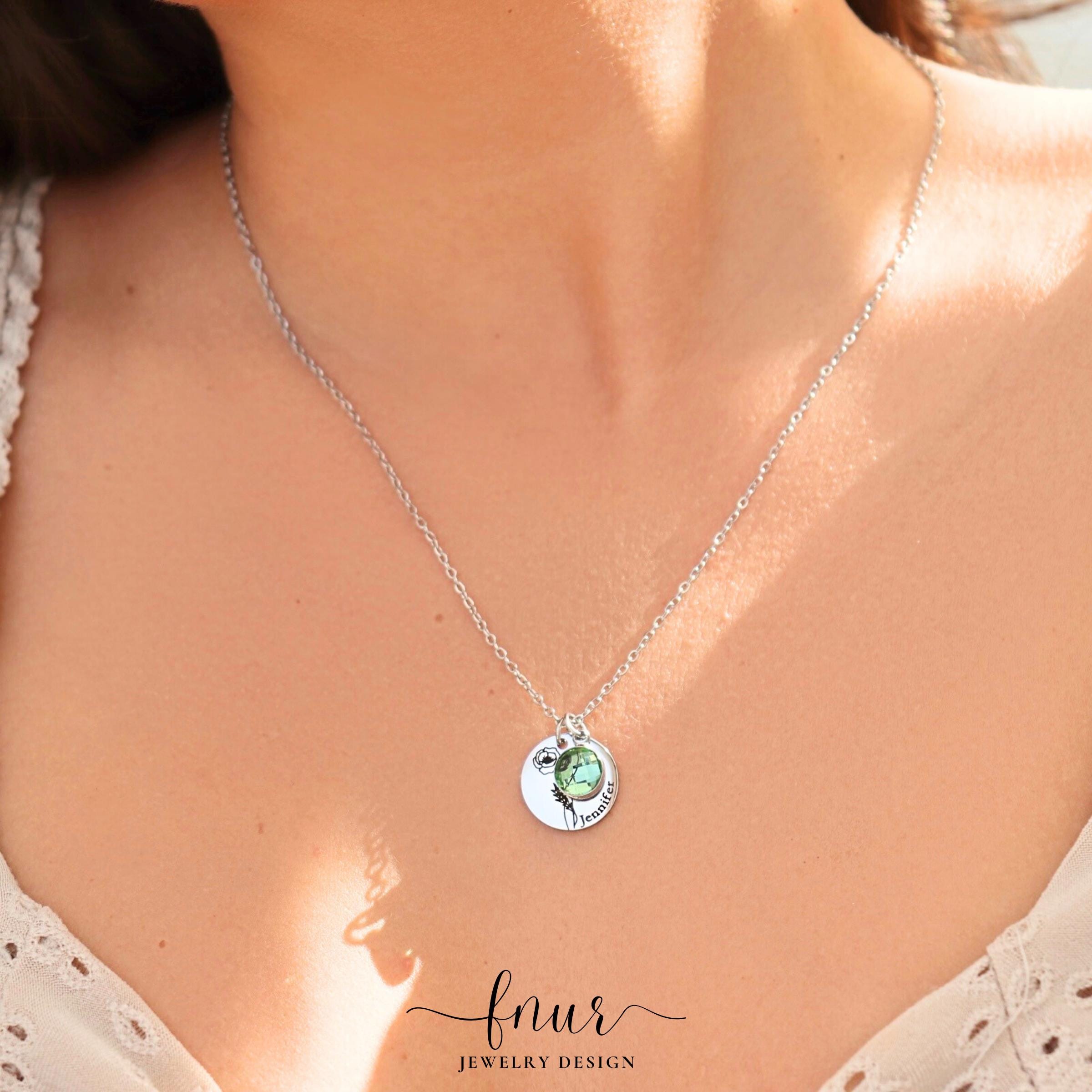 elegant rose gold birth flower pendant displayed against soft fabric for jewelry photography