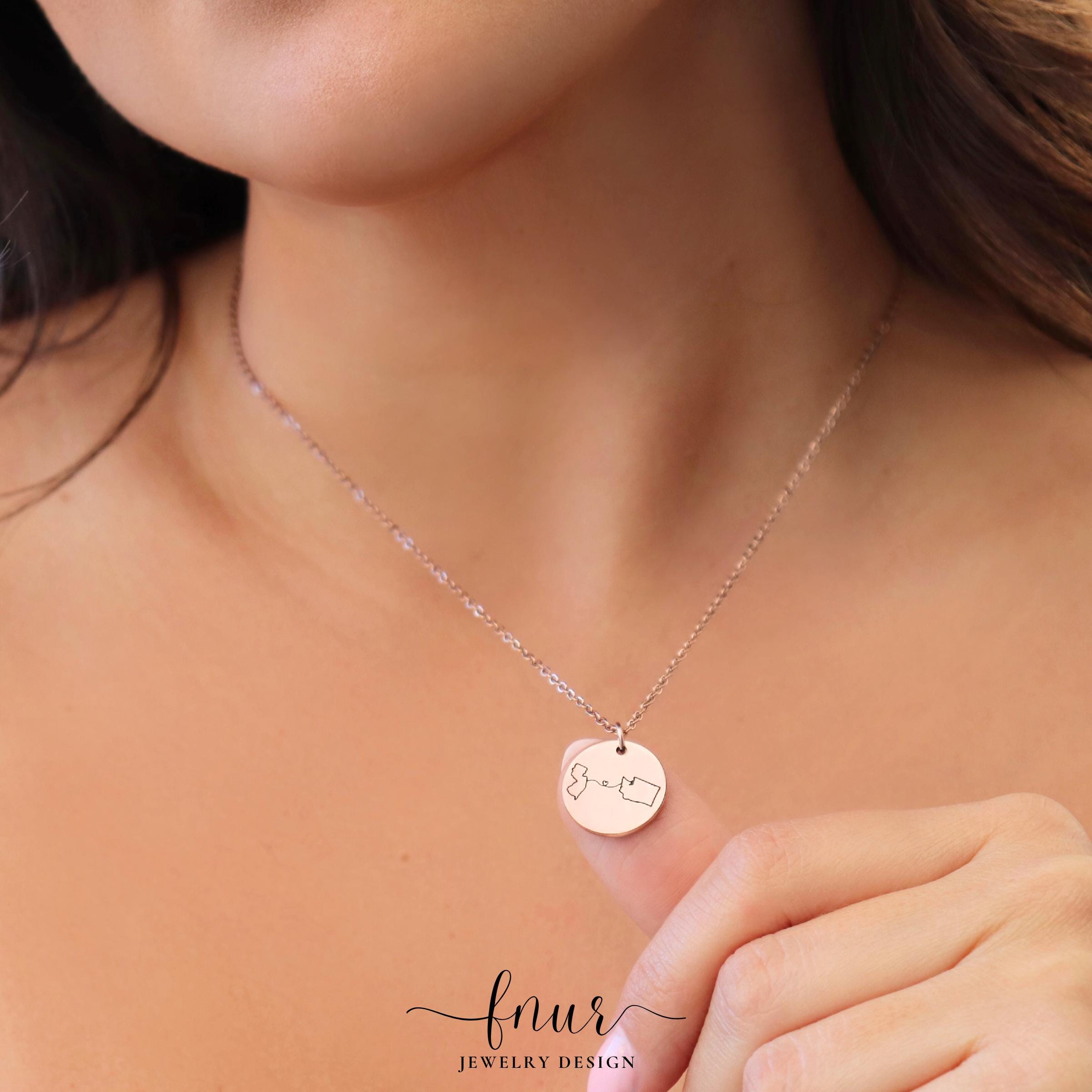 model wearing custom two state engraved pendant necklace showing perfect length and gold finish