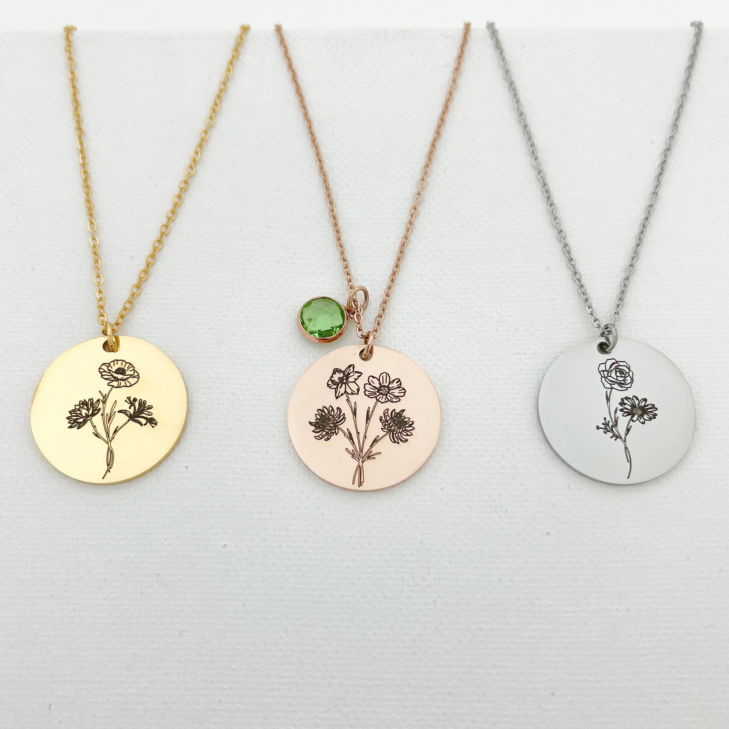 high detail view of engraved floral bouquet petals on custom birth month pendant
