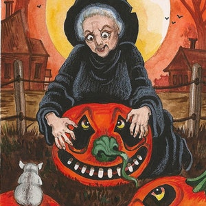 May include: A watercolor painting of a witch in a black hat and dress, holding a large orange pumpkin with a toothy grin. The witch is standing in front of a full moon and two other pumpkins, one with a white mouse on top.