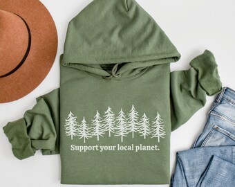 May include: A green hooded sweatshirt with a white graphic of a forest and the text "Support your local planet."
