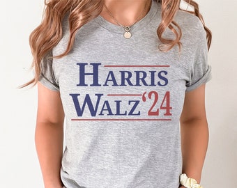 May include: A gray t-shirt with the text "HARRIS WALZ '24" printed in blue and red.