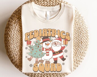 T-shirts de Noël pour pédiatrie, T-shirts de l'équipe de pédiatrie, T-shirts pour infirmières pédiatriques, T-shirts de Noël pour infirmières en pédiatrie, T-shirts pour aides-soignantes en pédiatrie, T-shirts pour pédiatrie dentaire