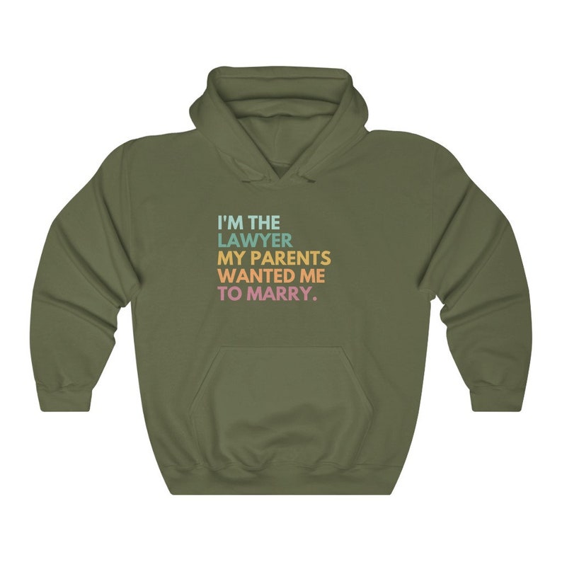 May include: A green hooded sweatshirt with the text "I'M THE LAWYER MY PARENTS WANTED ME TO MARRY." printed on the front in rainbow colors.