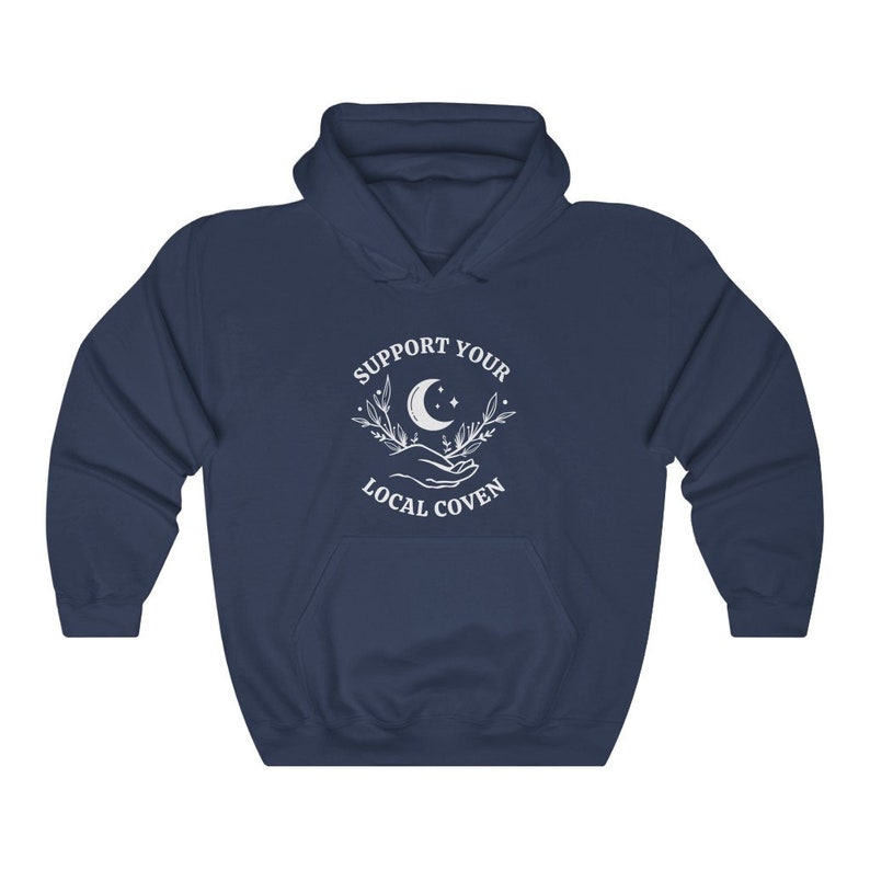 May include: Navy blue hooded sweatshirt with a white graphic design that says "Support Your Local Coven" with a crescent moon and stars.