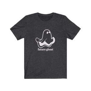 May include: A dark heather grey t-shirt with a white ghost graphic and the text "future ghost" printed on the front.