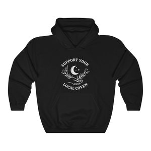 May include: Black hooded sweatshirt with a white graphic design that says "Support Your Local Coven" with a crescent moon and stars.