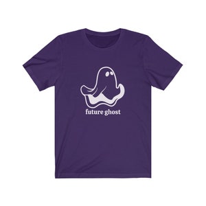 May include: Purple short-sleeved t-shirt with a white ghost graphic and the text "future ghost" printed on the front.