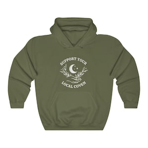 May include: A green hooded sweatshirt with a white graphic design that says "Support Your Local Coven" with a crescent moon and stars.