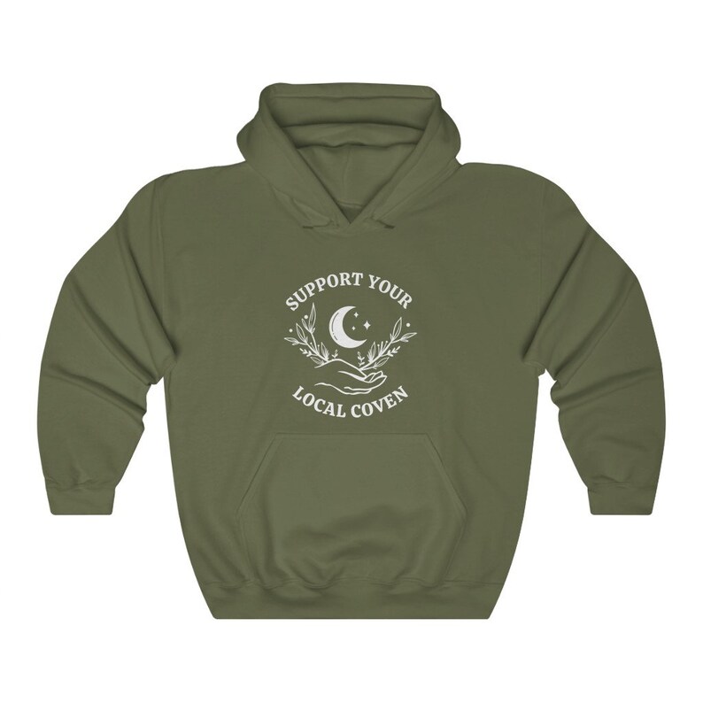 May include: A green hooded sweatshirt with a white graphic design that says "Support Your Local Coven" with a crescent moon and stars.