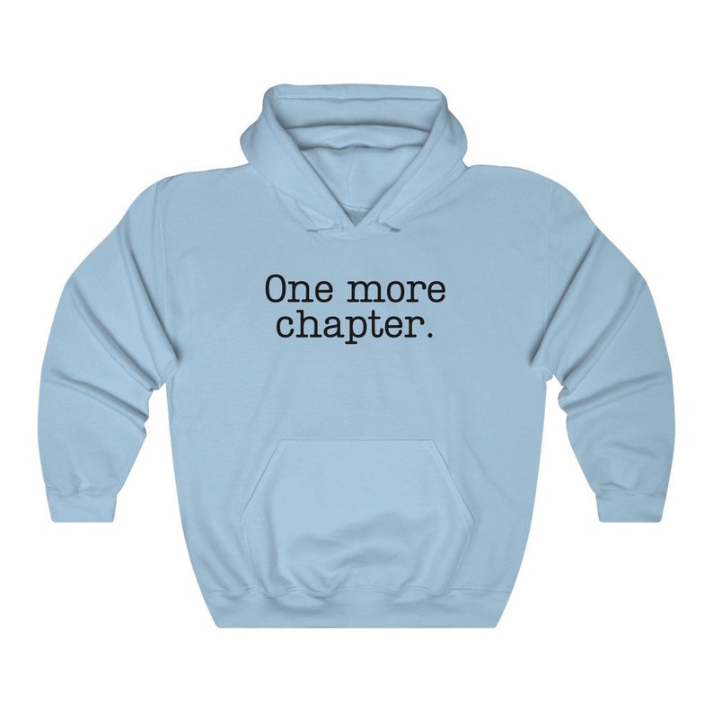 May include: Light blue hooded sweatshirt with the text "One more chapter." printed in black.