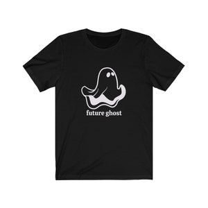 May include: Black t-shirt with a white ghost graphic and the text "future ghost" printed on the front.